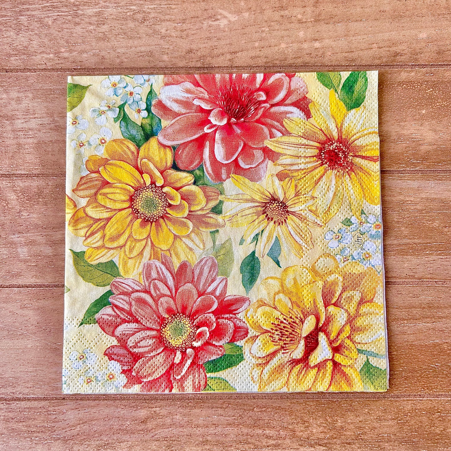 Floral-patterned napkin on a wooden surface
