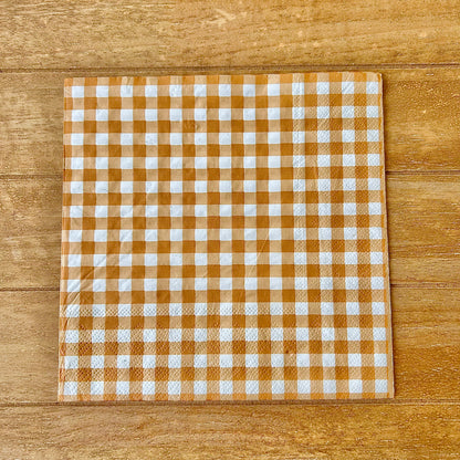 Checkered napkin with brown and white pattern on a wooden surface