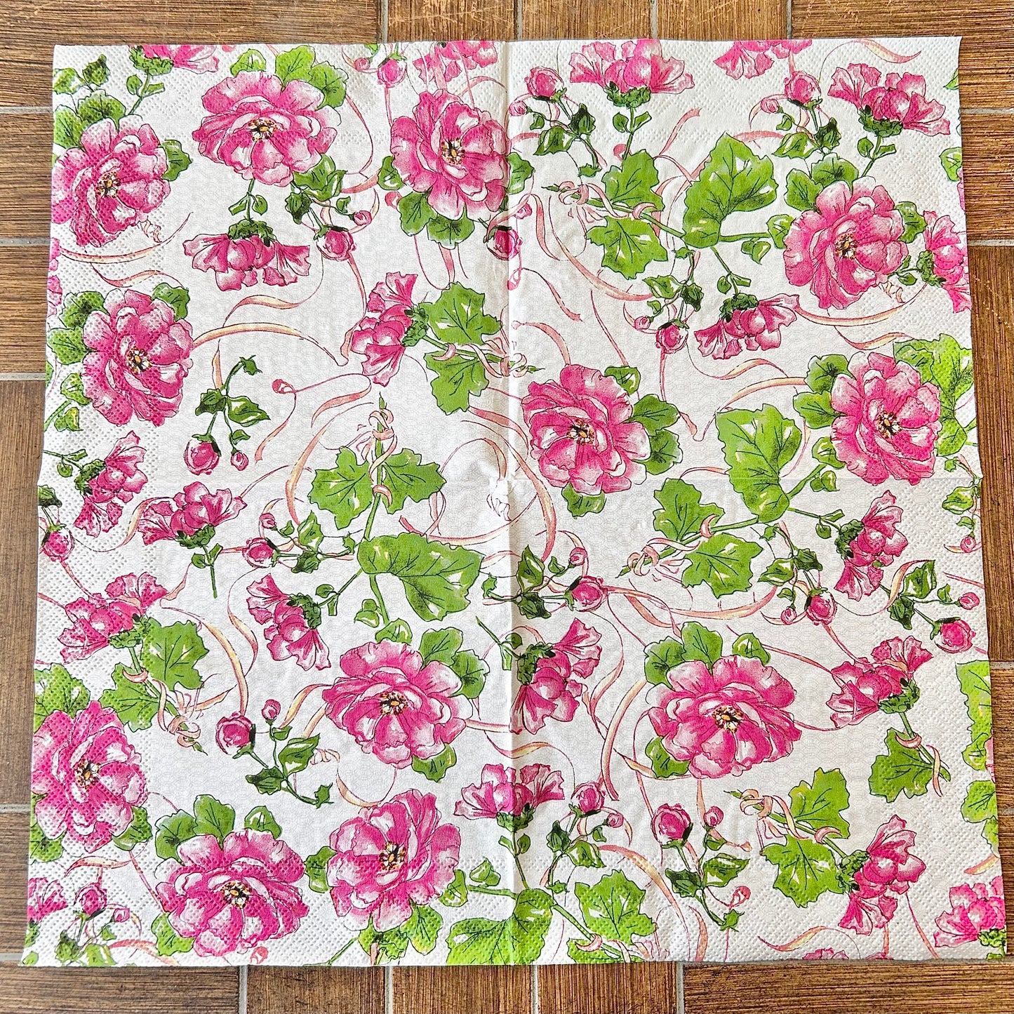 Floral patterned napkin on a wooden surface
