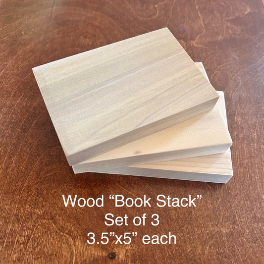 Stack of three wooden blocks on a wooden surface with text indicating size and quantity.